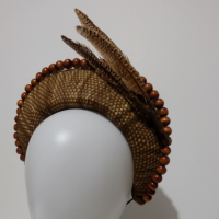brown headband with brown striped feathers